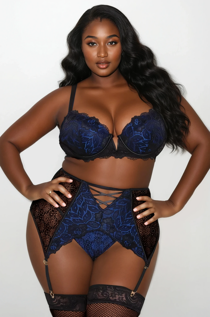 Back view of Blue Royale Two Piece Set showing strappy garterbelt design and adjustable lace bra on plus size model