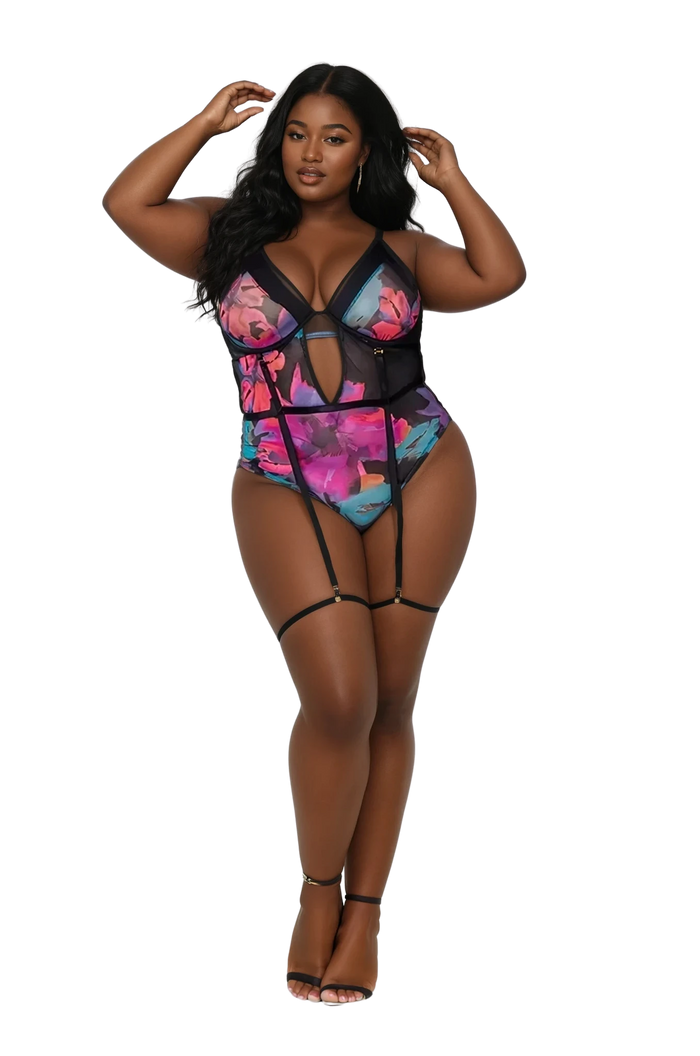 Plus size model wearing the Midnight Bloom Bodysuit in floral print front view