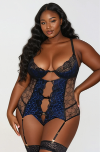 Plus size model wearing Sapphire Seduction Teddy in blue lace with black mesh and gold strap accents – Curvy Bombshells