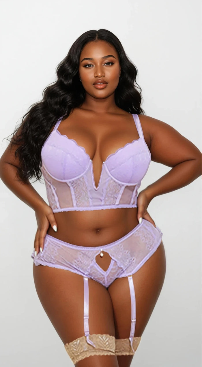 Plus size model wearing the Lavender Luxe Bra Set featuring molded cups, lace details, and garter straps — Curvy Bombshells lingerie.