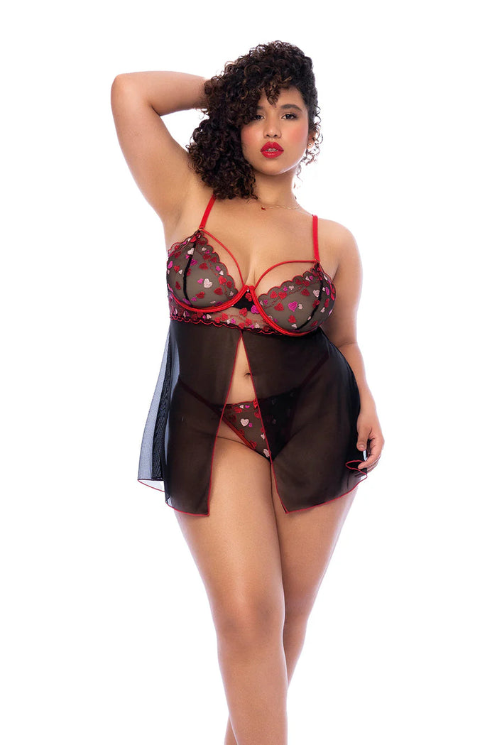 Plus size model wearing Lover Girl Babydoll black and red heart mesh lingerie set front view