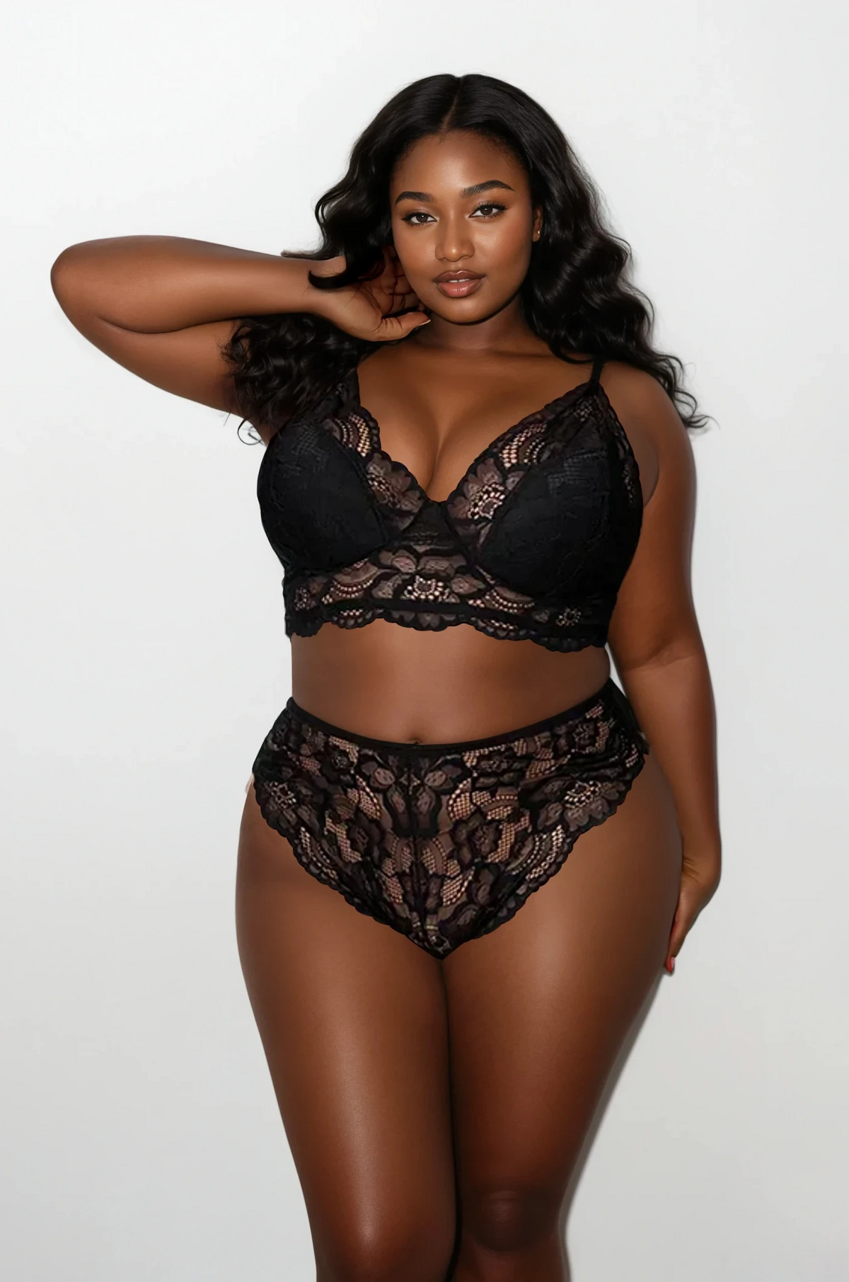 Plus size model wearing the Midnight Lace Two Piece Lingerie Set in black floral lace – front view by Curvy Bombshells