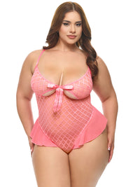 Plus Size Model wearing Pink Temptation Cutout Teddy featuring sheer flocked diamond mesh, open cutout cups, satin bow detail, and ruffle trim