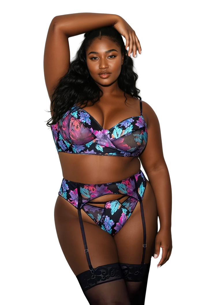 Plus size model wearing Twilight Blossom floral lingerie set with underwire bra, garter belt, and thong front view