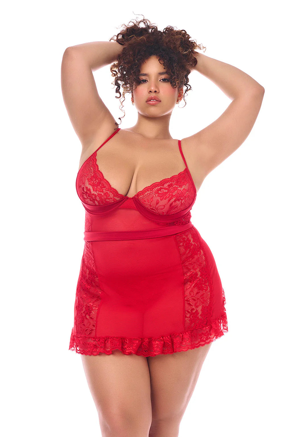 Plus Size Model wearing the Unwrap Me in Red Babydoll — sheer lace front with ruffled hem and underwire cups, featuring a romantic red design.