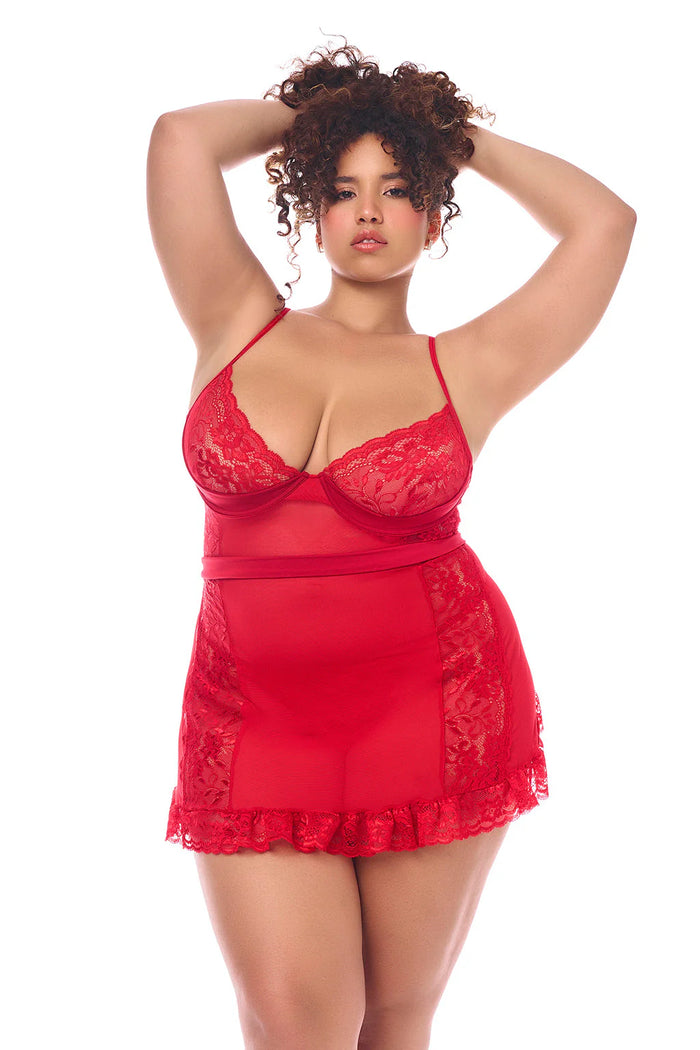 Plus Size Model wearing the Unwrap Me in Red Babydoll — sheer lace front with ruffled hem and underwire cups, featuring a romantic red design.