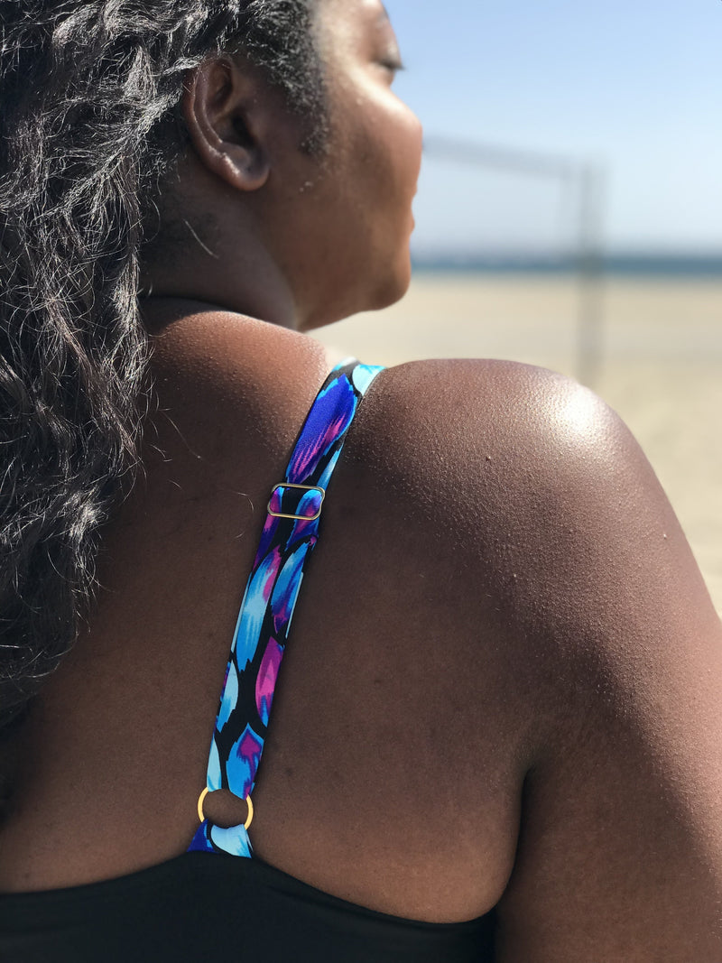 Close-up of fabric texture and strap design details on the plus-size Black Oasis Plunging One-Piece Swimsuit.